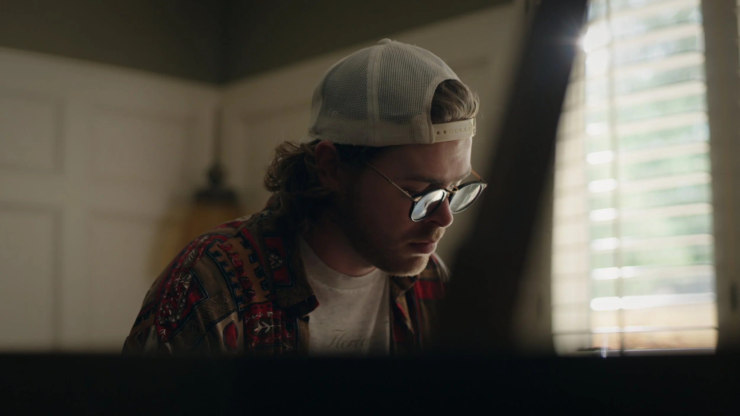 Jake Wells tuning a piano