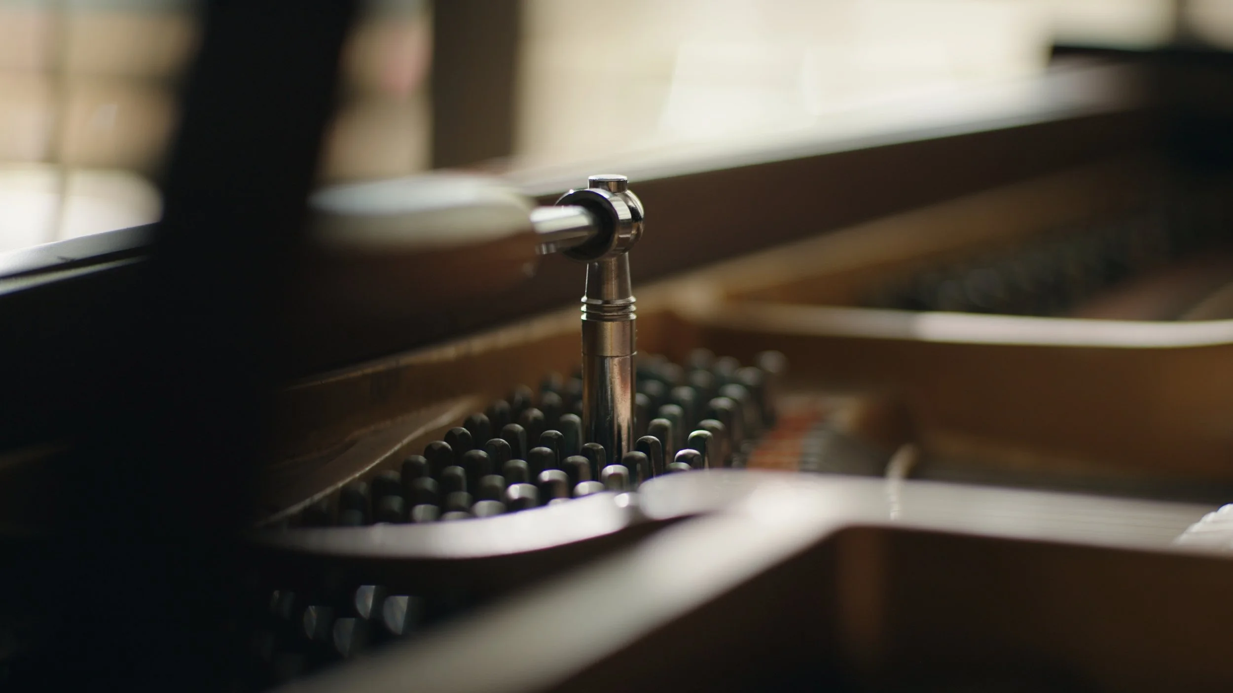 Close-up of piano tuning pins and strings